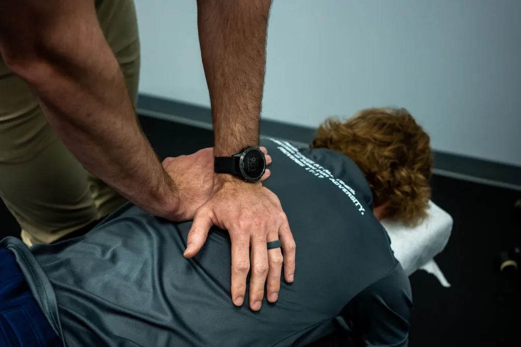 Dr. Drew adjusting a patient