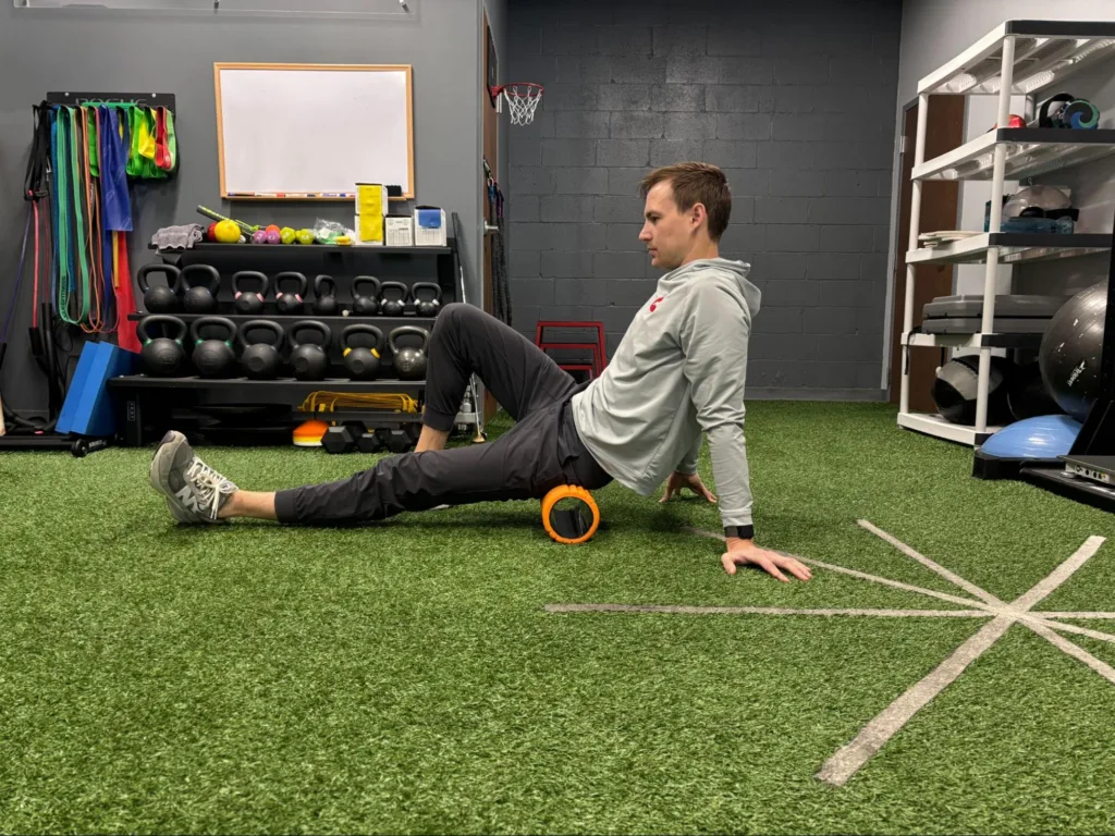 Foam rolling the outside of the hip