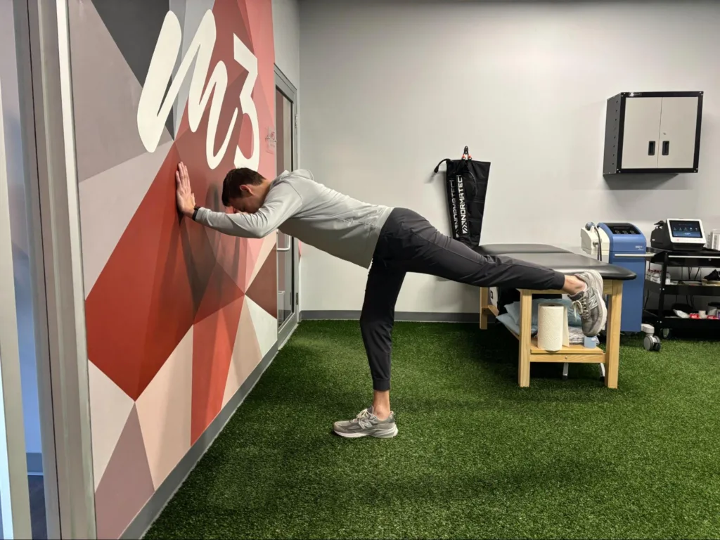 Wall airplane exercise for hip control